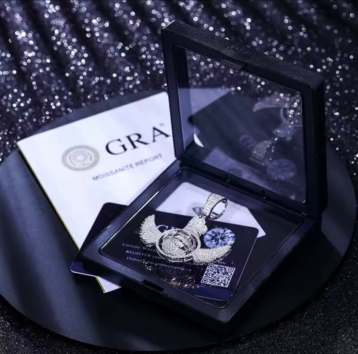 Rotating Global Wing Pendant